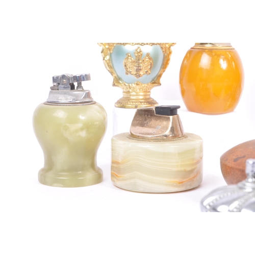 228 - A large collection of 20th century table lighters. The collection to include a variety of examples, ... 