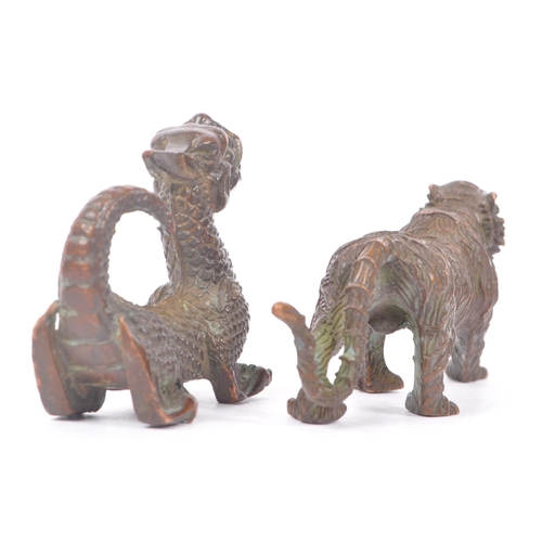 232 - Two Chinese bronze sculptures / figures. Comprising of a mythical Chinese dragon together with a wil... 