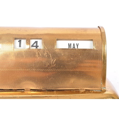 239 - A mid Century circa 1940s brass Stratton desktop perpetual calendar. The calendar raised on stepped ... 