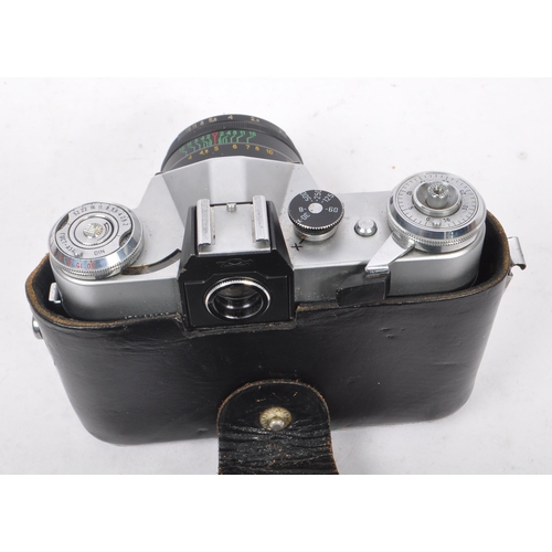 241 - Zenit - A mid 20th century circa 1960s Zenit E 35mm SLR camera. The camera having a silver metal bod... 