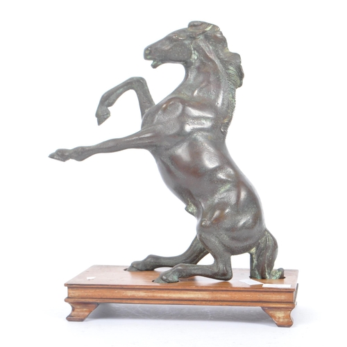 247 - A 20th century Chinese bronze horse statue figure on wooden stand. The horse raised on its hind legs... 