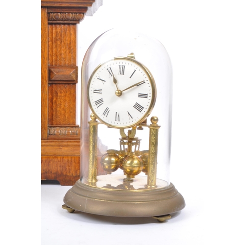 253 - A collection of vintage 20th century mantel clocks. Including two Art Deco style examples, with carr... 