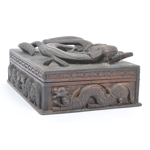 258 - A vintage 20th century Asian oriental Chinese dragon stationary box. With carved relief dragon detai... 