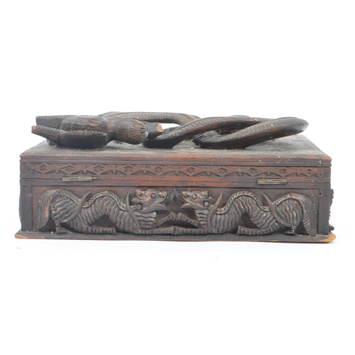 258 - A vintage 20th century Asian oriental Chinese dragon stationary box. With carved relief dragon detai... 