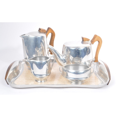 259 - Picquot Ware - A mid Century retro picquot ware tea service comprising of a teapot, hot water pot, m... 