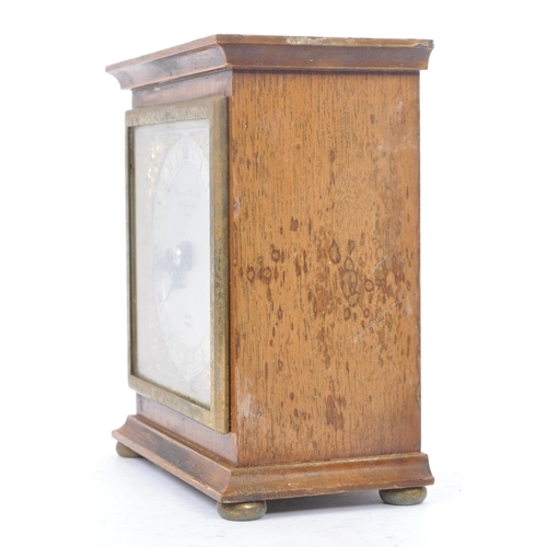 262 - Gerrard & Co. Ltd Elliott London - A 20th Century oak mantle clock of square form with silver face a... 