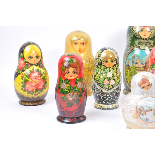 263 - A collection of late 20th century and later Russian USSR folk art Matryoshka graduating nest of doll... 