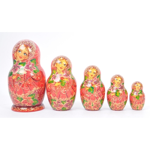 263 - A collection of late 20th century and later Russian USSR folk art Matryoshka graduating nest of doll... 