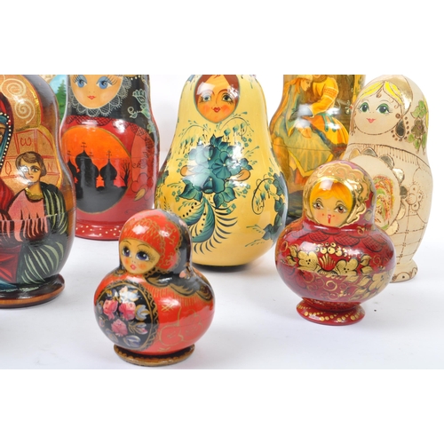 265 - A collection of late 20th century and later Russian USSR folk art Matryoshka graduating nest of doll... 