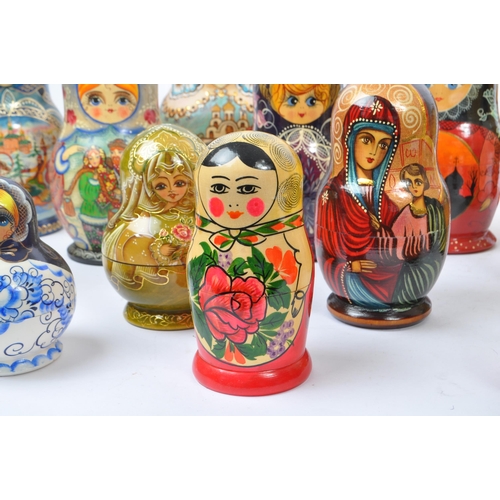 265 - A collection of late 20th century and later Russian USSR folk art Matryoshka graduating nest of doll... 