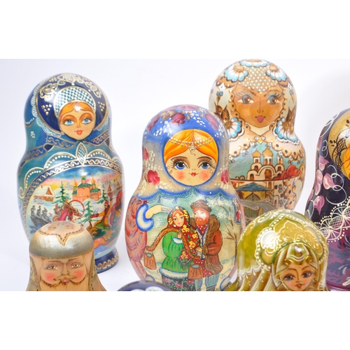 265 - A collection of late 20th century and later Russian USSR folk art Matryoshka graduating nest of doll... 