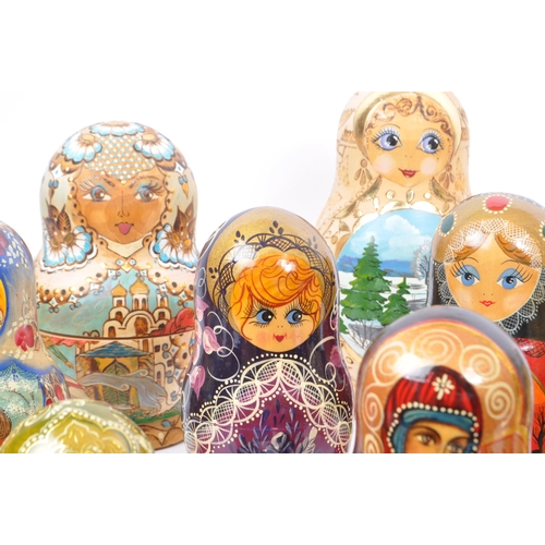 265 - A collection of late 20th century and later Russian USSR folk art Matryoshka graduating nest of doll... 