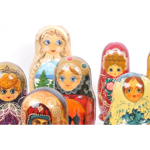 265 - A collection of late 20th century and later Russian USSR folk art Matryoshka graduating nest of doll... 