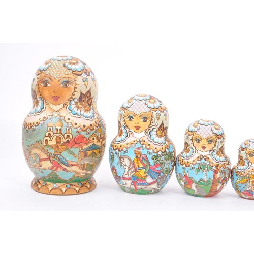 265 - A collection of late 20th century and later Russian USSR folk art Matryoshka graduating nest of doll... 