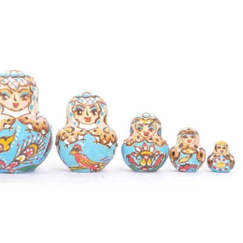 265 - A collection of late 20th century and later Russian USSR folk art Matryoshka graduating nest of doll... 