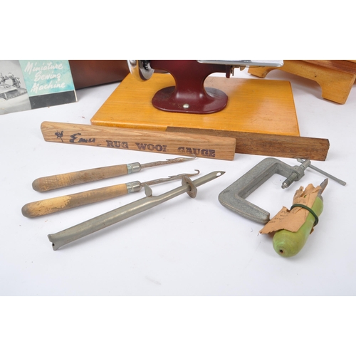 270 - Essex - A vintage mid 20th century Essex miniature sewing machine. The machine held within a leather... 