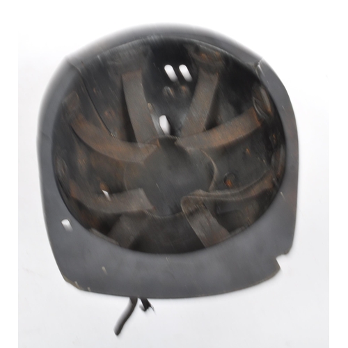 282 - A mid Century vintage leather coal miners safety helmet with number 145 etched into the underneath o... 