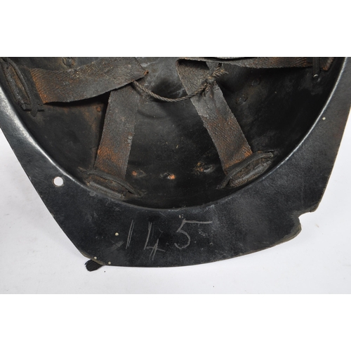 282 - A mid Century vintage leather coal miners safety helmet with number 145 etched into the underneath o... 