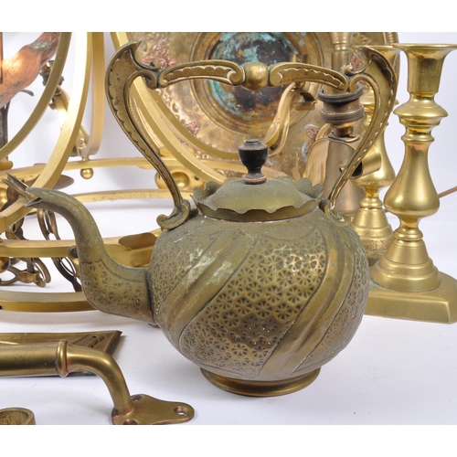 285 - A collection of brass and copper items to include a decorative spirit kettle on stand, six candlesti... 