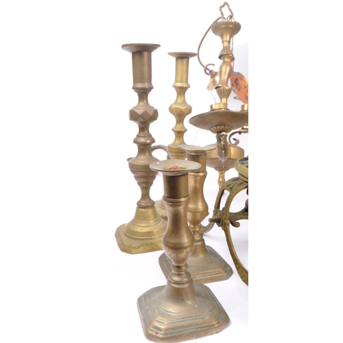 285 - A collection of brass and copper items to include a decorative spirit kettle on stand, six candlesti... 