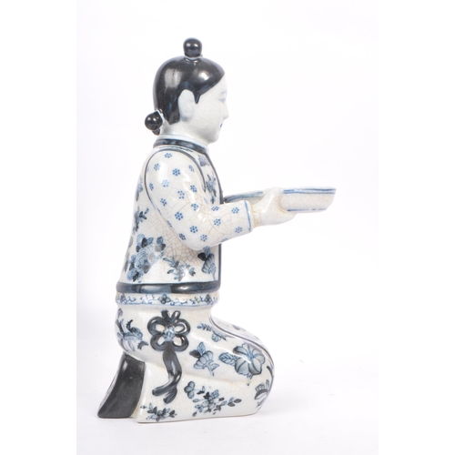 29 - Two oriental early 20th Century 1920s Chinese porcelain figures holding bowls, one female in traditi... 