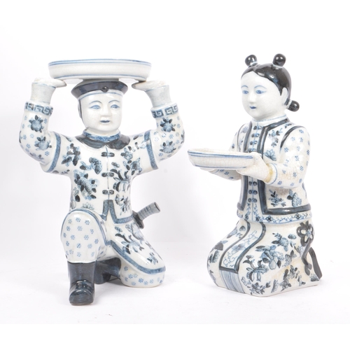 29 - Two oriental early 20th Century 1920s Chinese porcelain figures holding bowls, one female in traditi... 