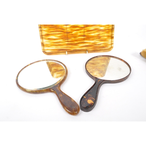 292 - An early 20th century xylonite celluloid vanity set. The set in a tortoise shell colouring, consisti... 