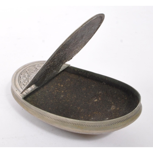 294 - A 19th century 1898 Victorian metal snuff box. The snuff box of oval curved form, with engraving ove... 