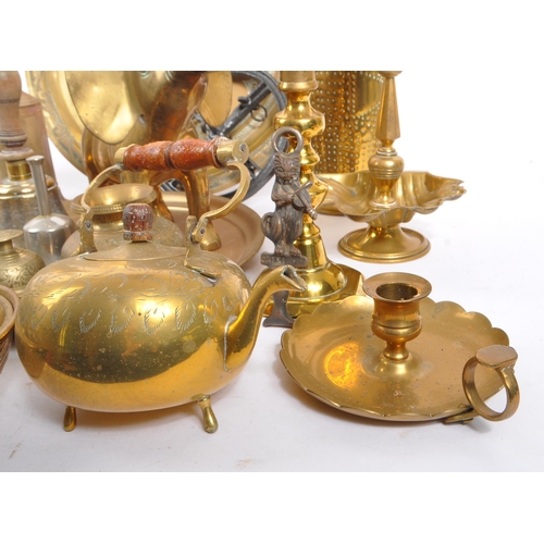 296 - A collection of brass items to include a John Linwood roasting spit jack, candlesticks, bowls, a lar... 