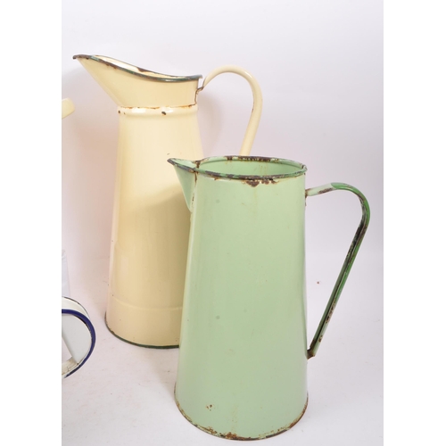 298 - A collection of vintage 20th century kitchen enamel ware. Including barrel / soup pot, water jugs, k... 