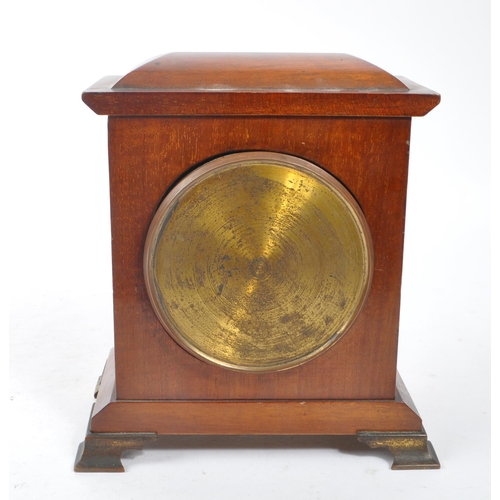 304 - An Edwardian walnut inlaid mantle clock with SRFA French movement having roman numerals to face. The... 