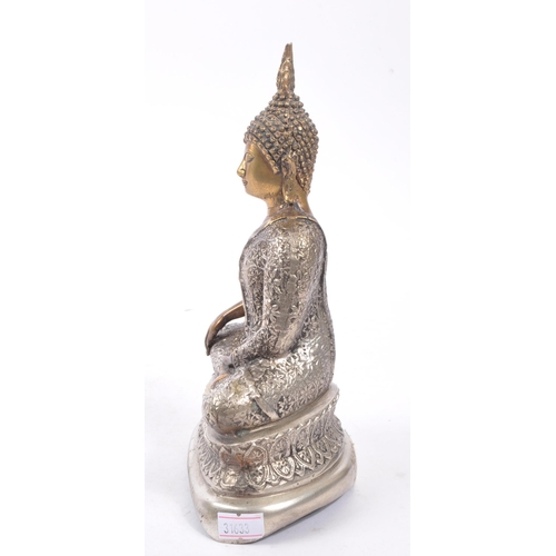 307 - A 20th Century painted bronze figure in the form of Buddha in seated position with legs crossed in s... 