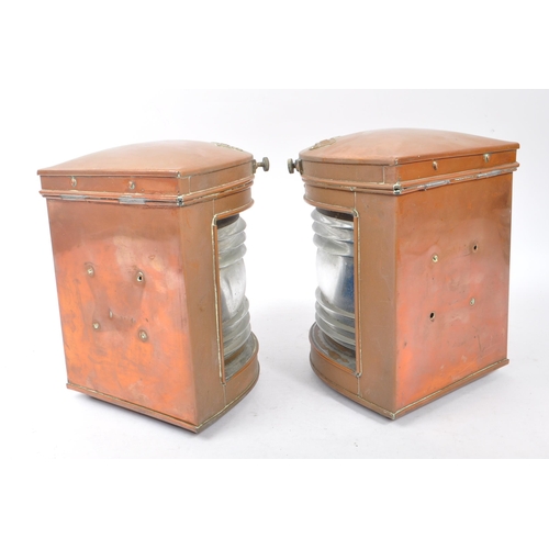 309 - A pair of early 20th century copper and brass ships port and starboard navigation lamps. The lamps o... 