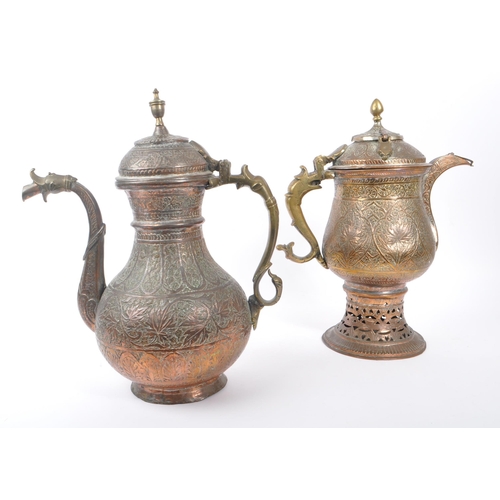 314 - Two early 20th century Indian / Tibetan water / kettle copper and brass jugs. With embossed decorati... 