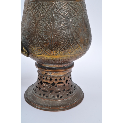 314 - Two early 20th century Indian / Tibetan water / kettle copper and brass jugs. With embossed decorati... 