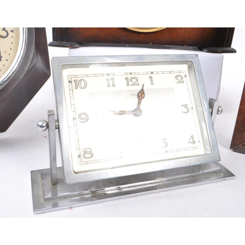 321 - Smiths - A collection of four clocks to include a Smiths Sectric Bakelite wall clock, a Smiths Enfie... 