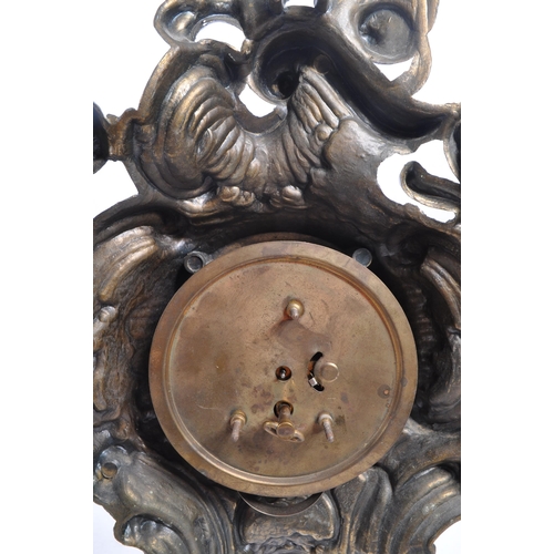 323 - A 20th Century ornate Art Nouveau style West Germany face moulded gilt metal mantel clock having flo... 