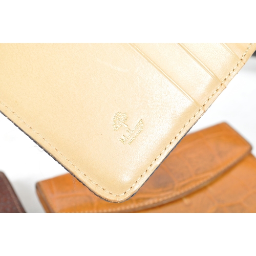 325 - Mulberry - London - A collection of leather luxury designer purse / wallets. Together with a pocket ... 