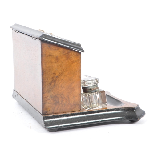 335 - A Victorian 19th century walnut desk tidy inkwell. Glass inkwells, bowls and pen tray beneath uprigh... 