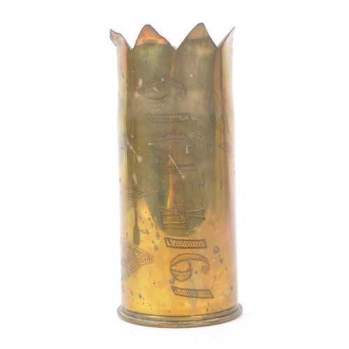 339 - An early 20th Century First World War brass trench art vase from artillery shell, engraved with leaf... 