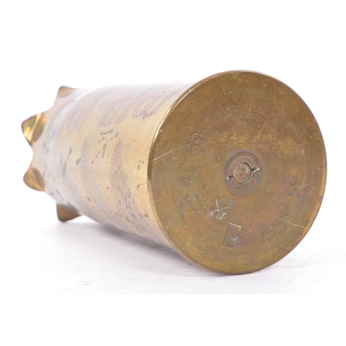 339 - An early 20th Century First World War brass trench art vase from artillery shell, engraved with leaf... 