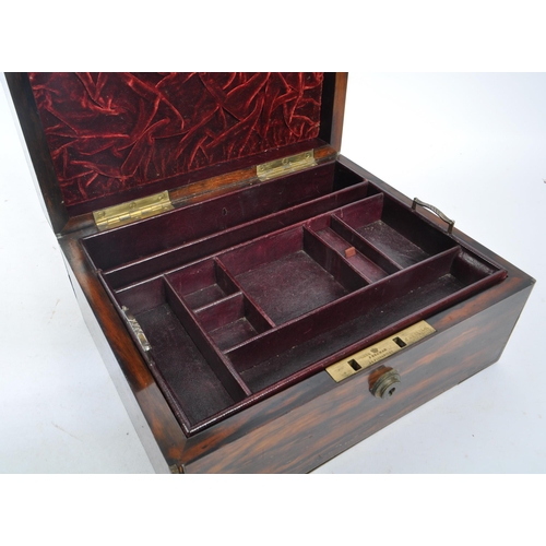 340 - A 19th century coromandel wood and brass cartouche inlaid leather ladies' vanity box. With contents ... 