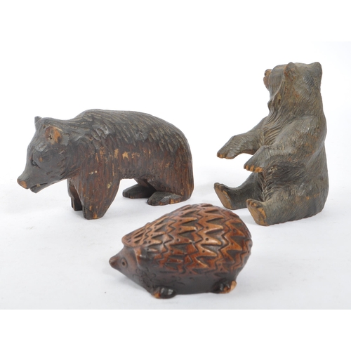 345 - Two vintage 20th Century Black Forest hand carved wooden bears, one stood on all fours, the other si... 