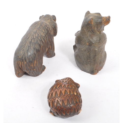 345 - Two vintage 20th Century Black Forest hand carved wooden bears, one stood on all fours, the other si... 