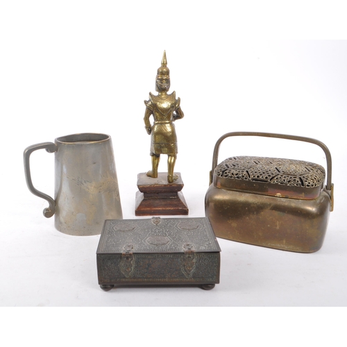 348 - A brass Nepalese warrior figure upon a stepped square wooden base, accompanied by a brass handled bo... 