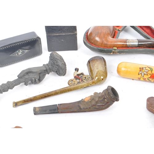 349 - A collection of vintage 19th century and 20th century smoking pipes to include carved wooden example... 