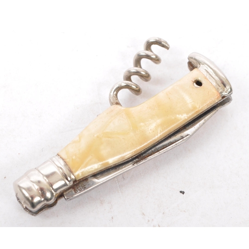 352 - Silver pick with ball finial on tapering chase body. Also, white metal and ivorine corkscrew, white ... 