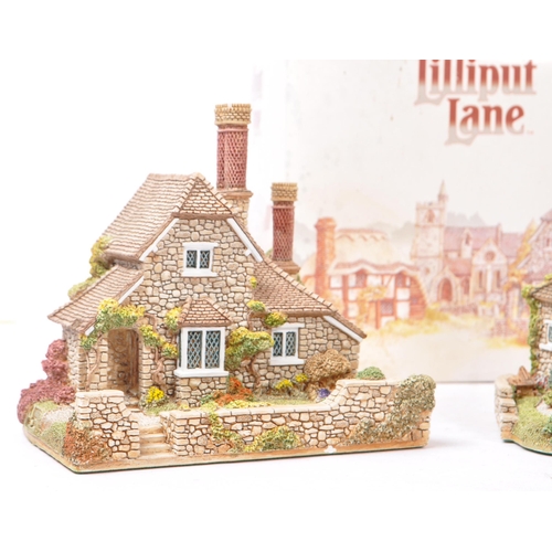 358 - Lilliput Lane - A collection of late 20th century house / cottage resin figurines / ornaments. To in... 