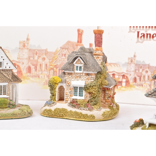 358 - Lilliput Lane - A collection of late 20th century house / cottage resin figurines / ornaments. To in... 