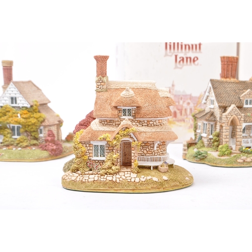 358 - Lilliput Lane - A collection of late 20th century house / cottage resin figurines / ornaments. To in... 